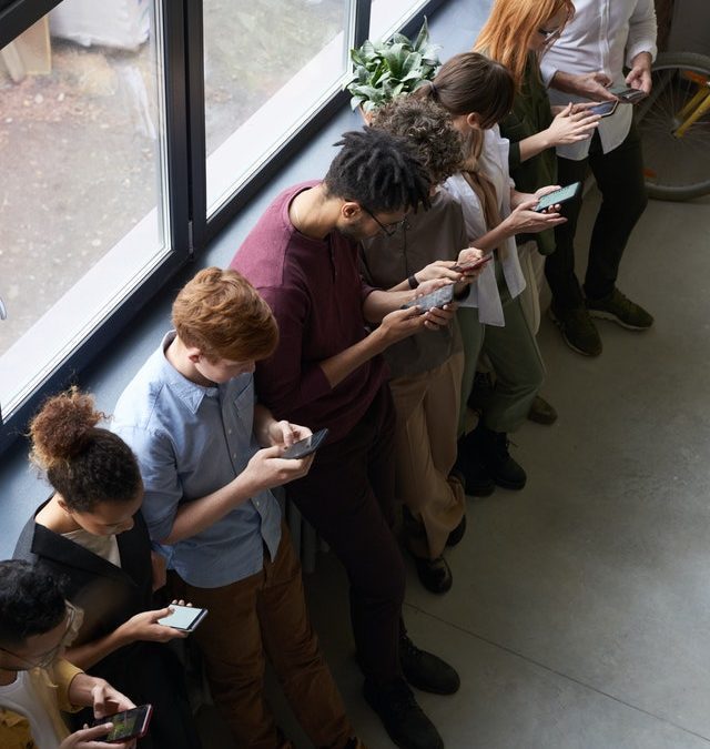 people on their smartphones